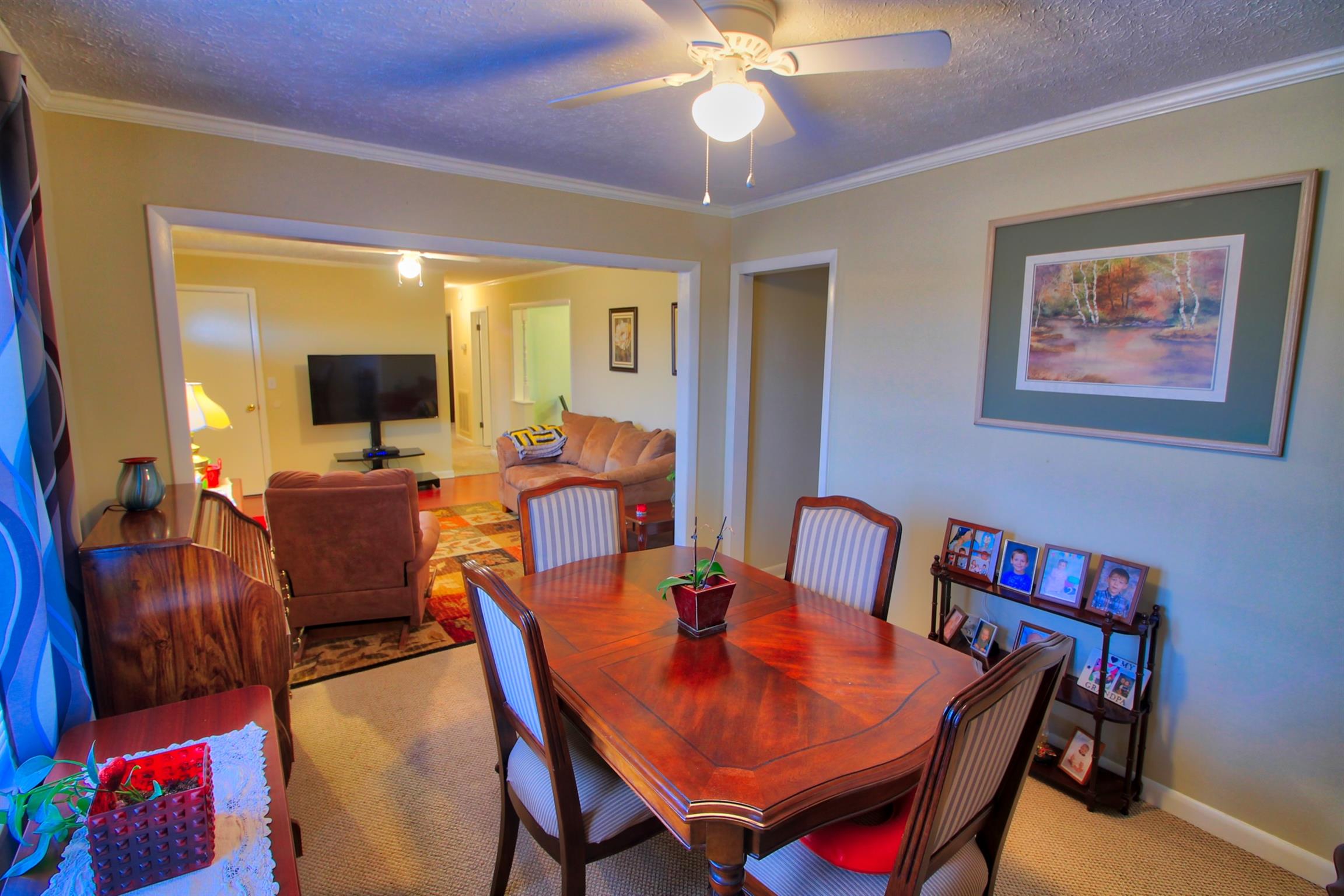 350 Jim Courtney Road Portland, TN 37148 - Photo 5 of 16 a view of a dining room with furniture and a chandelier fan