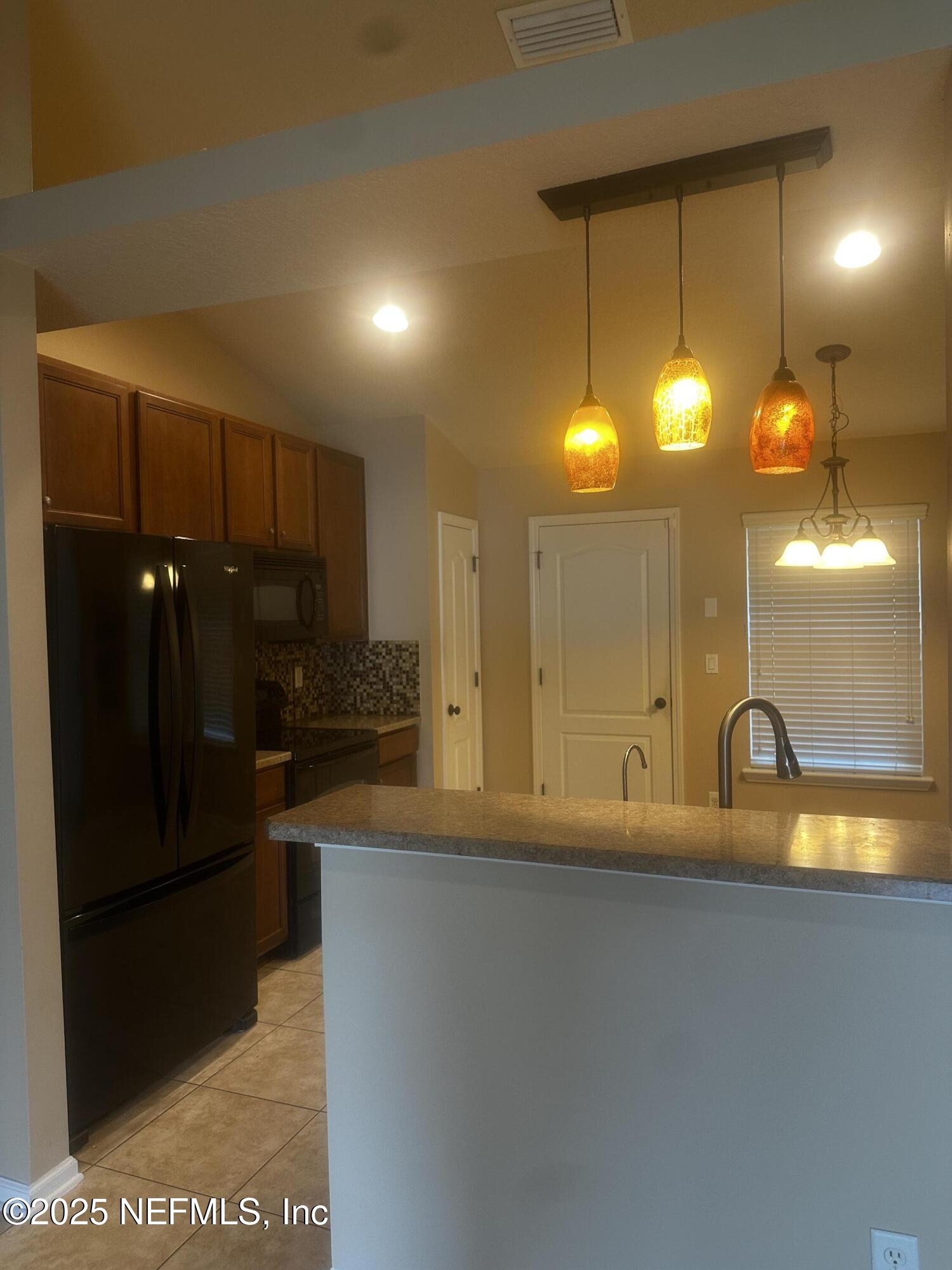 45157 Ingleham Circle Callahan, FL 32011 - Photo 13 of 48 a bathroom with a sink and a mirror