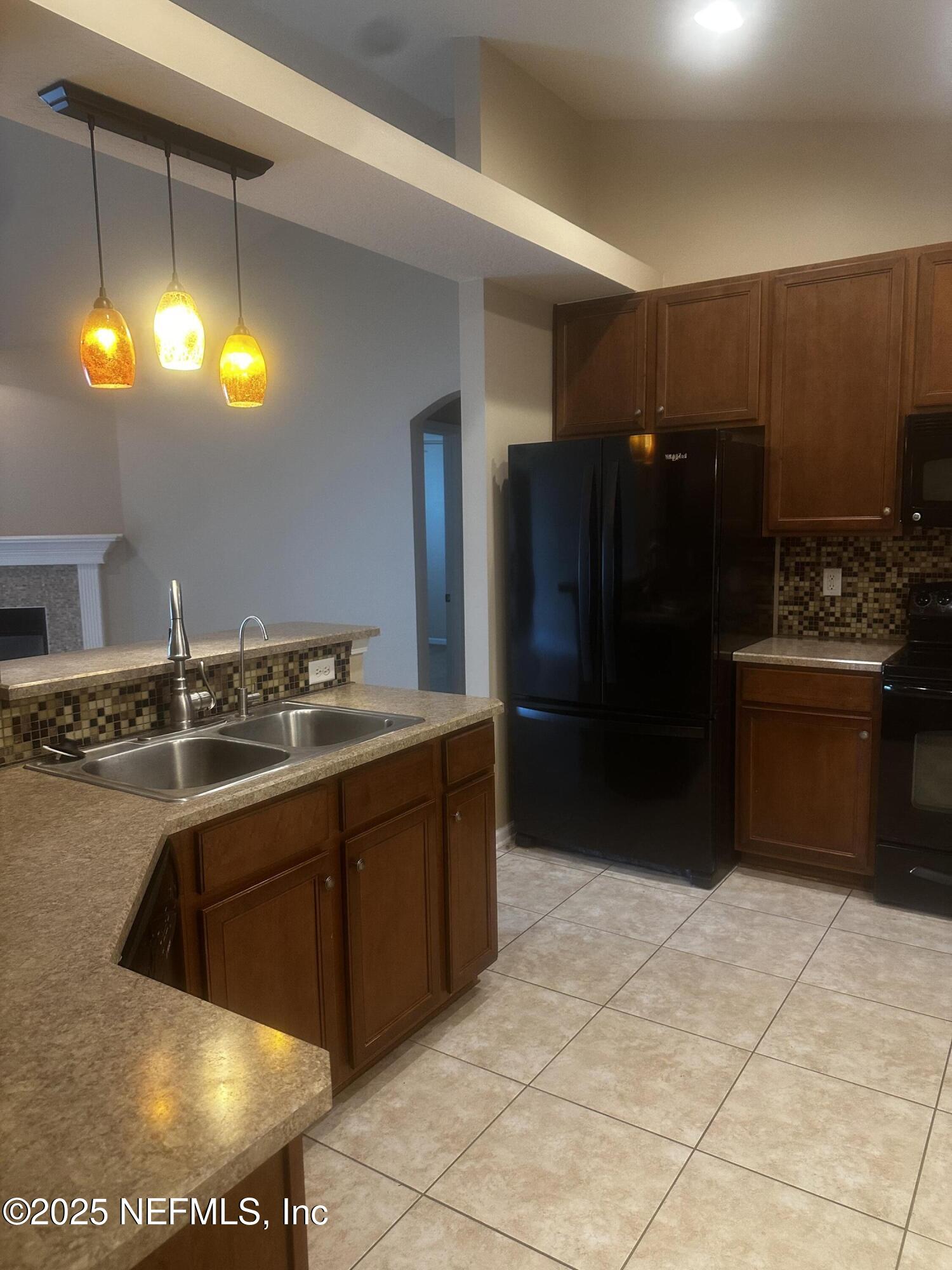 45157 Ingleham Circle Callahan, FL 32011 - Photo 14 of 48 a bathroom with a sink vanity and a mirror