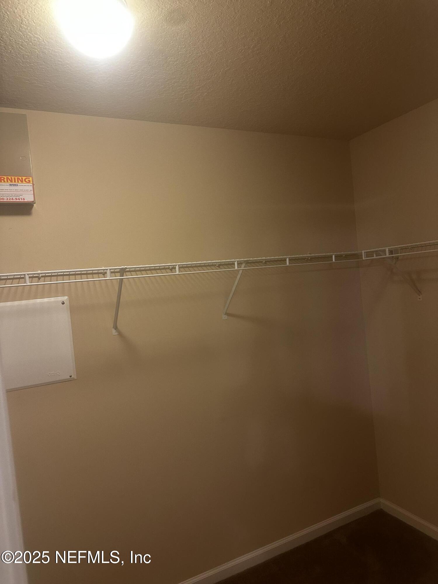 45157 Ingleham Circle Callahan, FL 32011 - Photo 28 of 48 a view of a room with racks on the wall