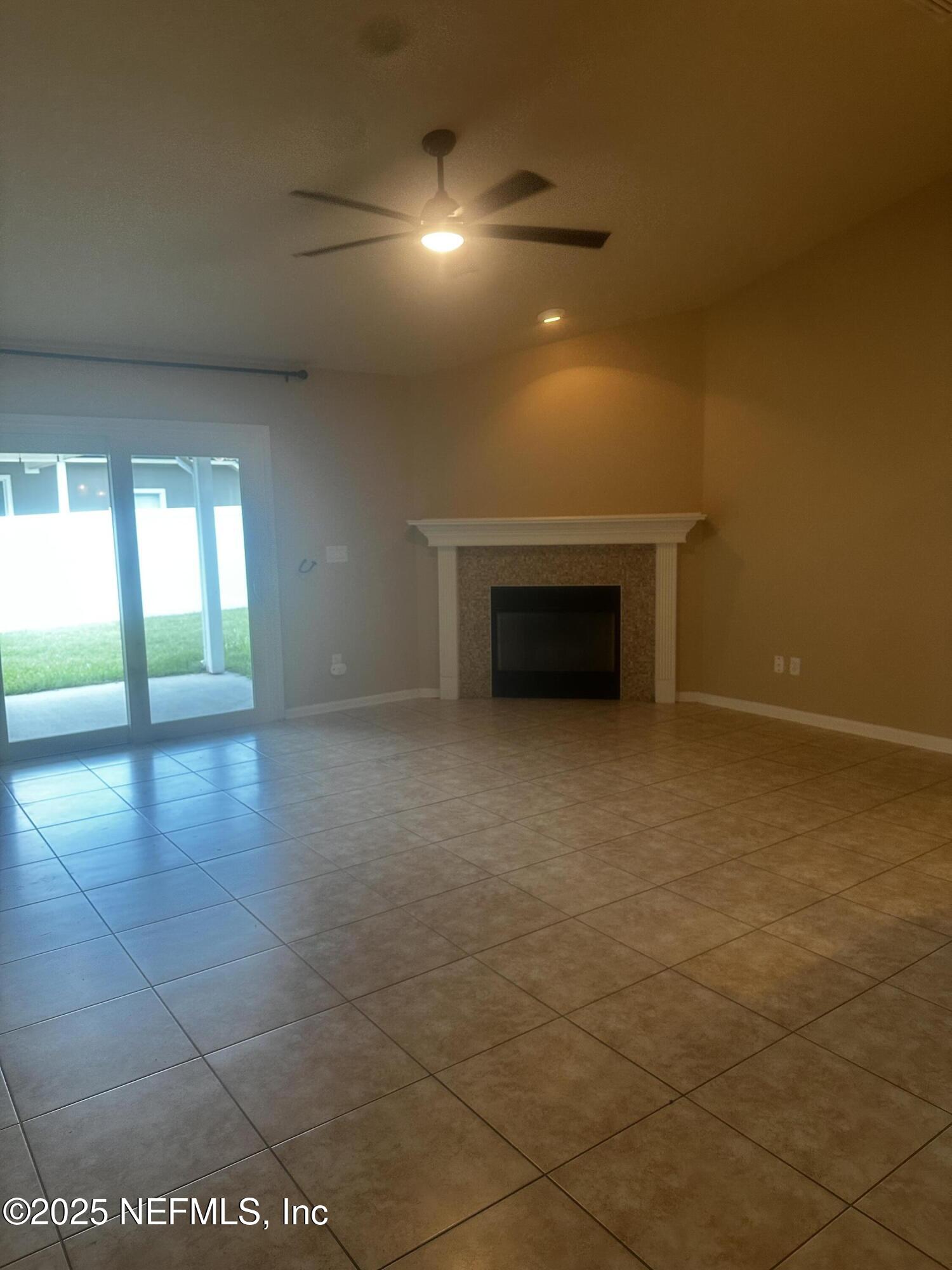 45157 Ingleham Circle Callahan, FL 32011 - Photo 31 of 48 a view of an empty room with a fireplace