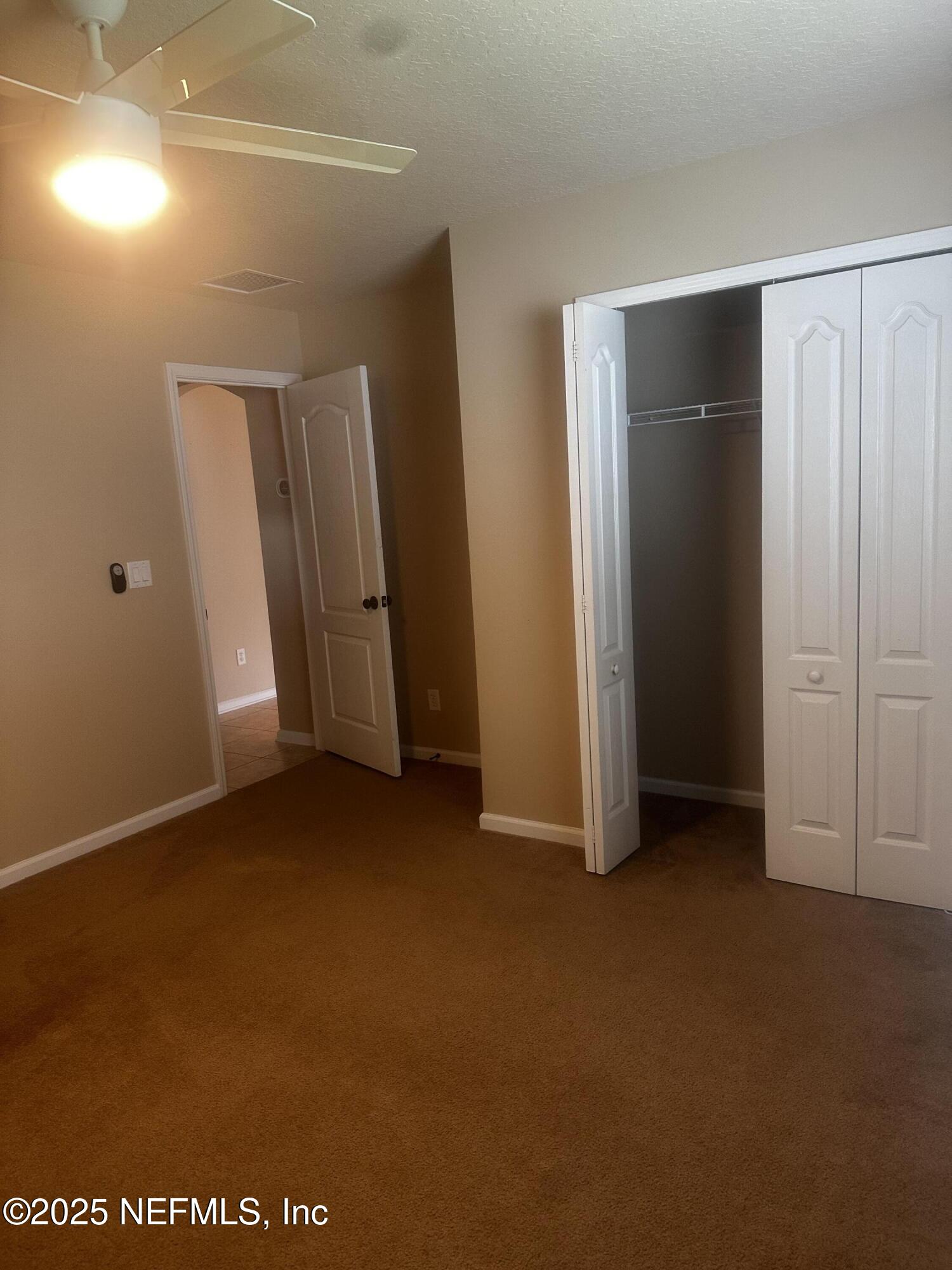 45157 Ingleham Circle Callahan, FL 32011 - Photo 35 of 48 an empty room with closet area