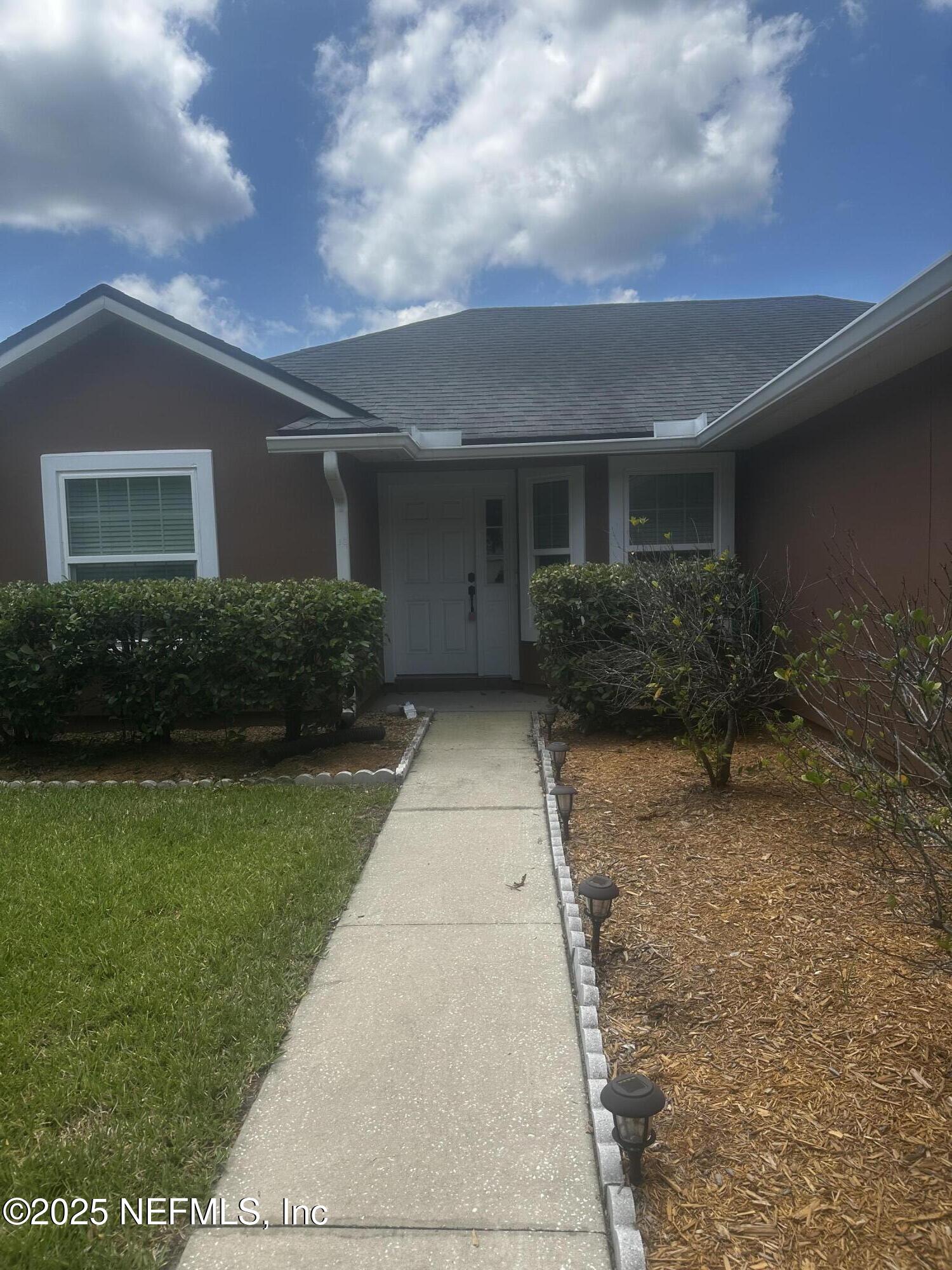 45157 Ingleham Circle Callahan, FL 32011 - Photo 4 of 48 a pathway of a house