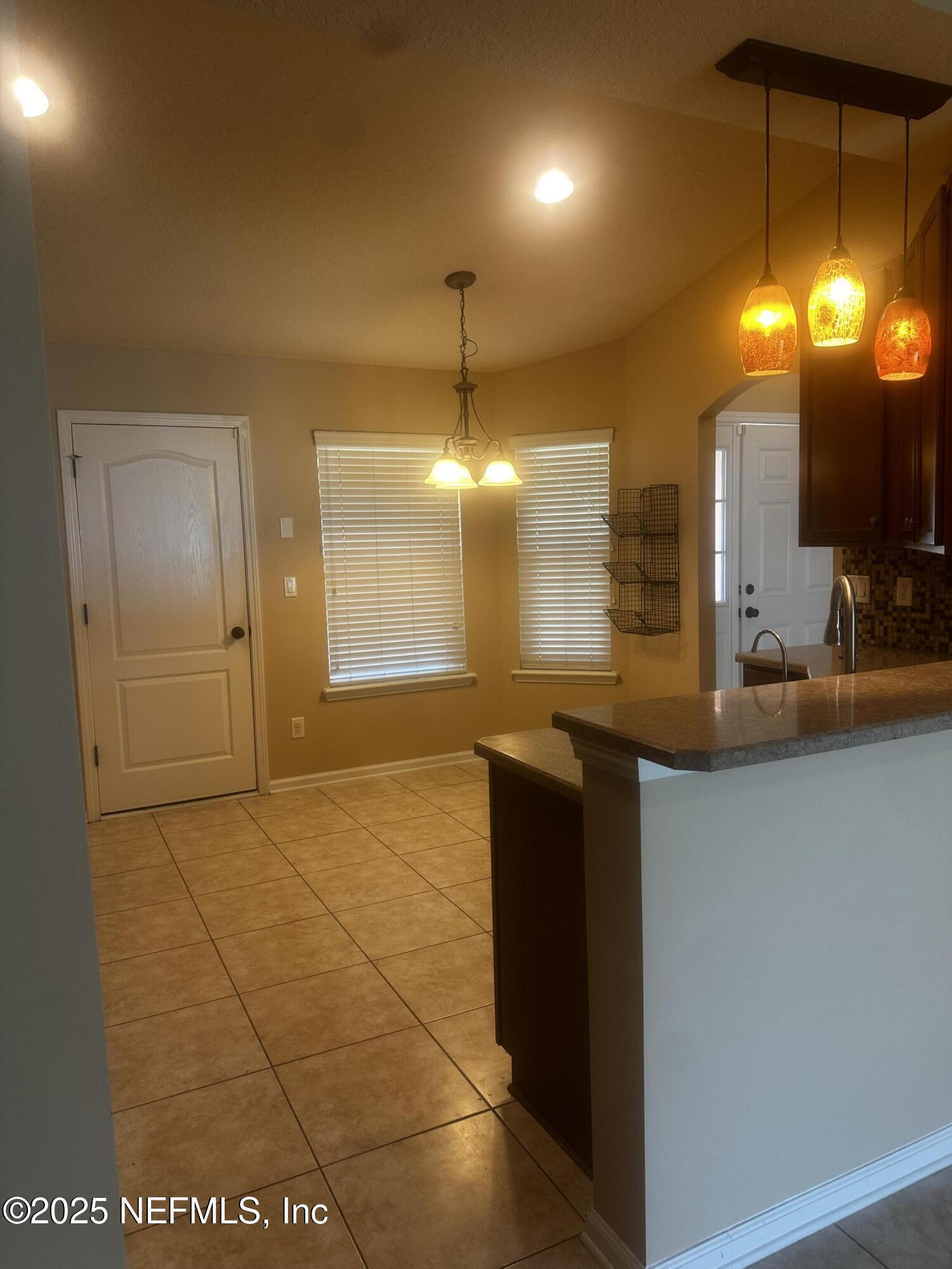 45157 Ingleham Circle Callahan, FL 32011 - Photo 43 of 48 a bathroom with a sink and a mirror