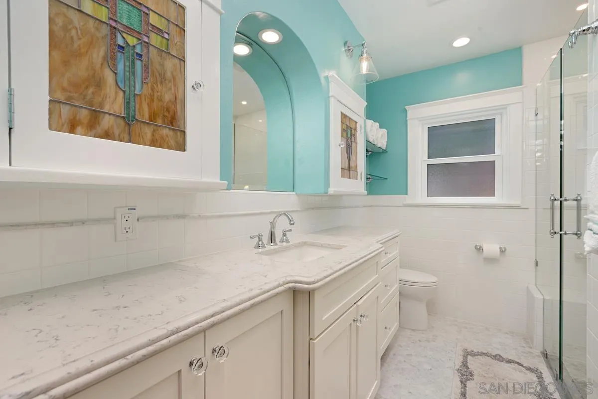4169 Rochester Road San Diego, CA 92116 - Photo 18 of 30 a bathroom with a sink and a mirror
