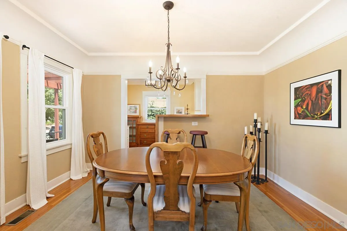 4169 Rochester Road San Diego, CA 92116 - Photo 8 of 30 a view of a dining room with furniture window and wooden floor