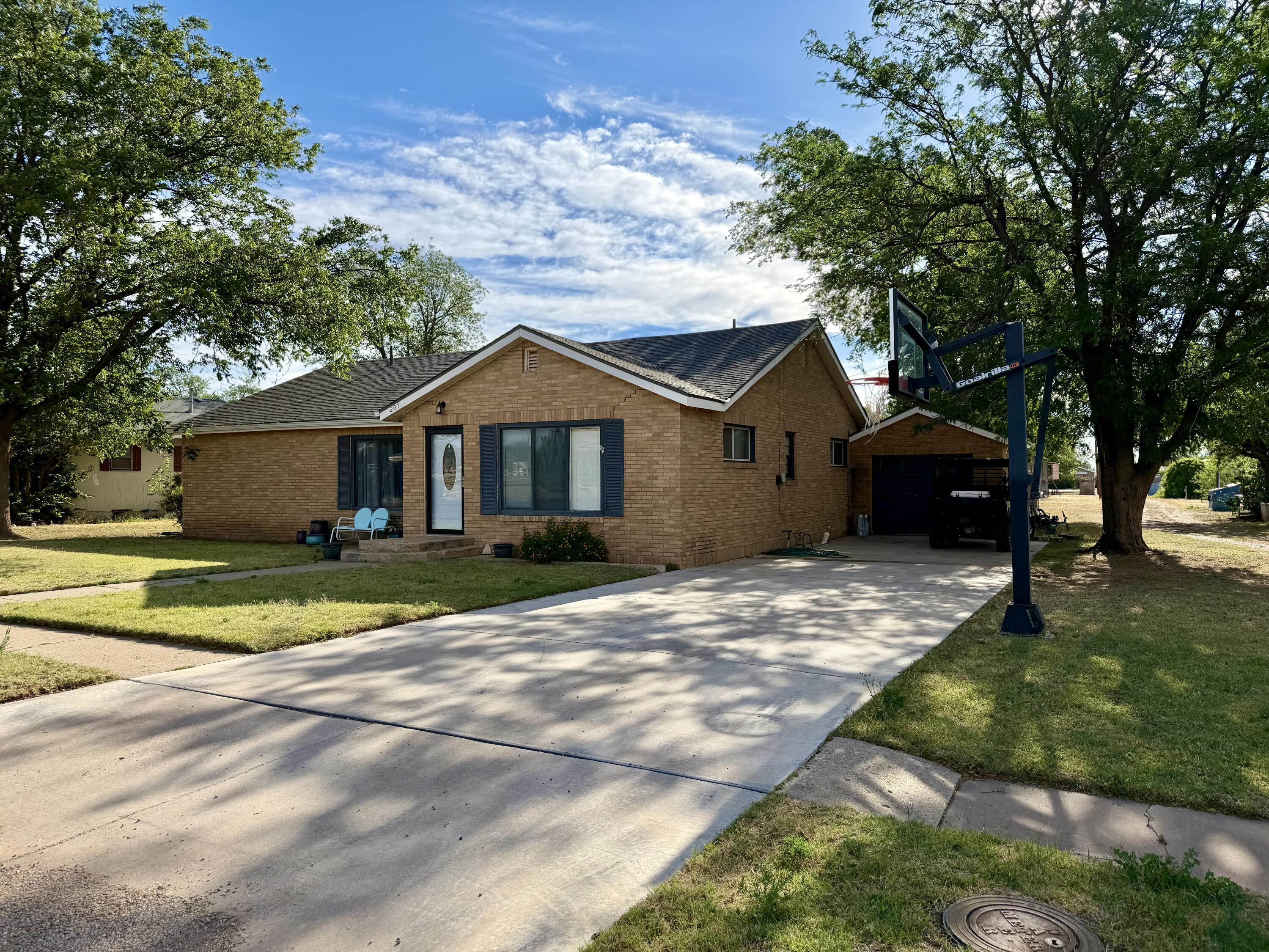 207 2nd Street Quitaque, TX 79255 - Photo 2 of 9 a front view of a house with a garden