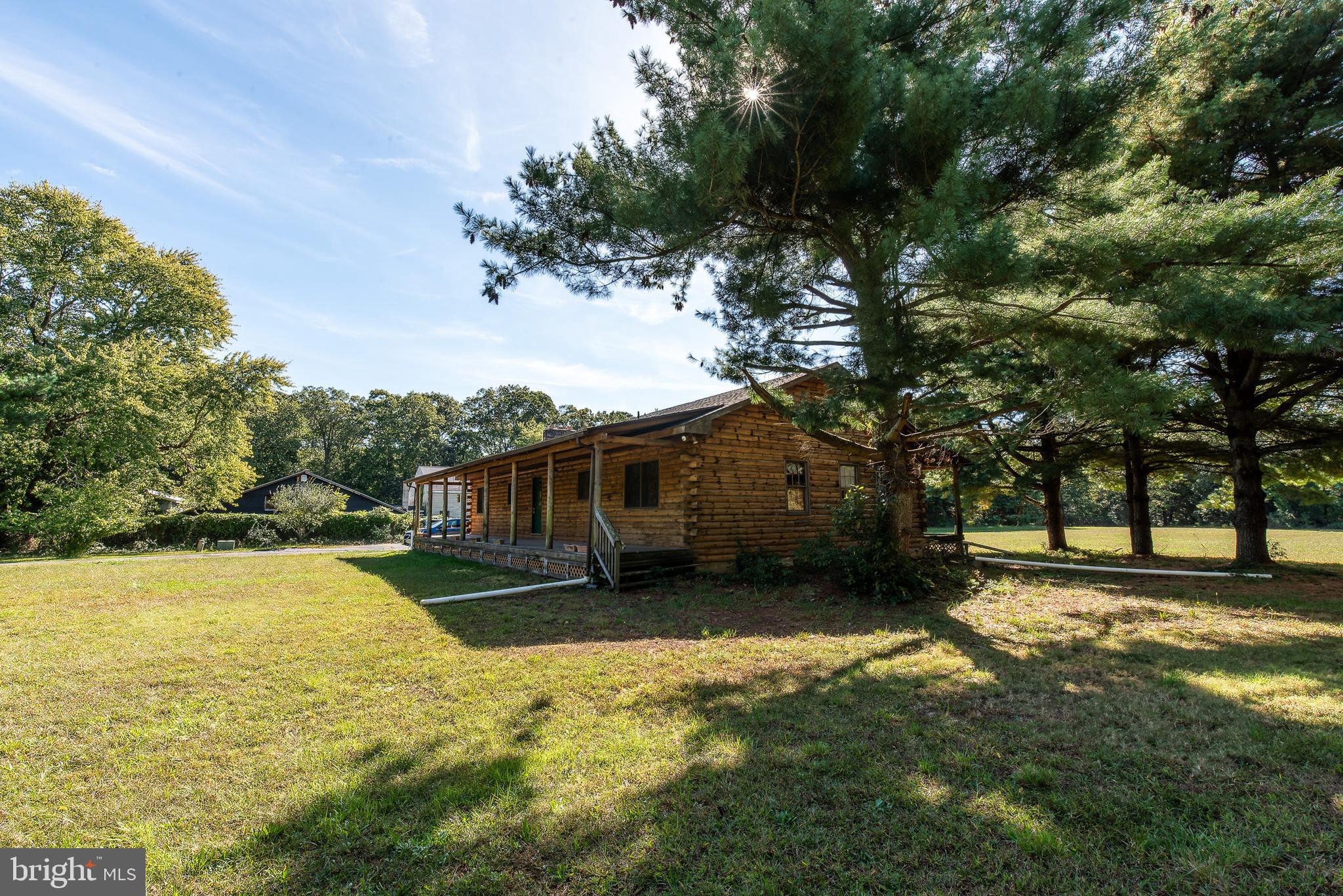 337 Harding Highway Pittsgrove, NJ 08318 - Photo 12 of 68 a view of a yard with wooden fence