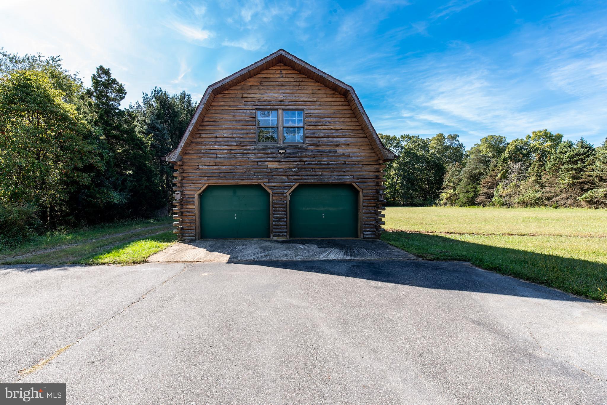 337 Harding Highway Pittsgrove, NJ 08318 - Photo 14 of 68 a front view of a house with a yard and garage