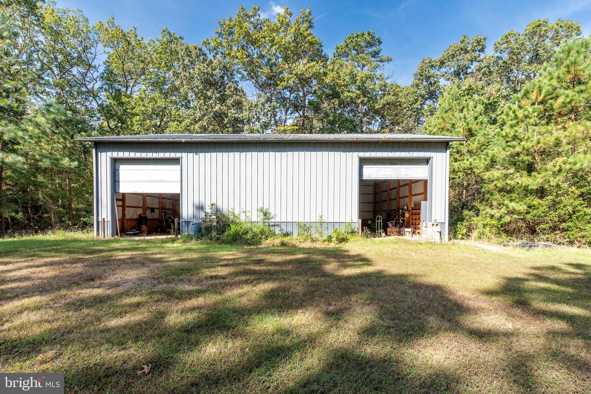337 Harding Highway Pittsgrove, NJ 08318 - Photo 26 of 68 a front view of a house with a yard and garage