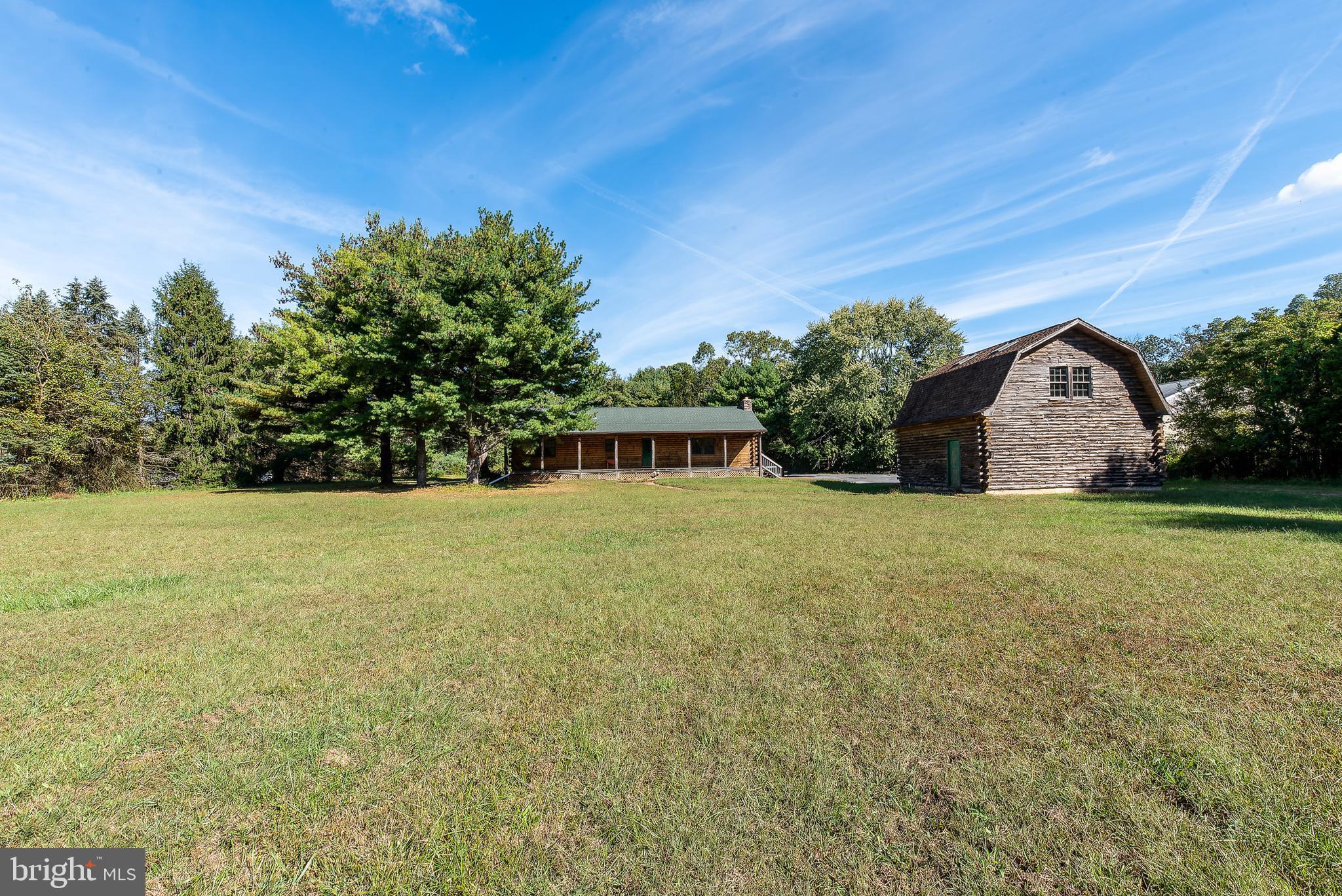 337 Harding Highway Pittsgrove, NJ 08318 - Photo 9 of 68 a front view of house with yard and trees in the background