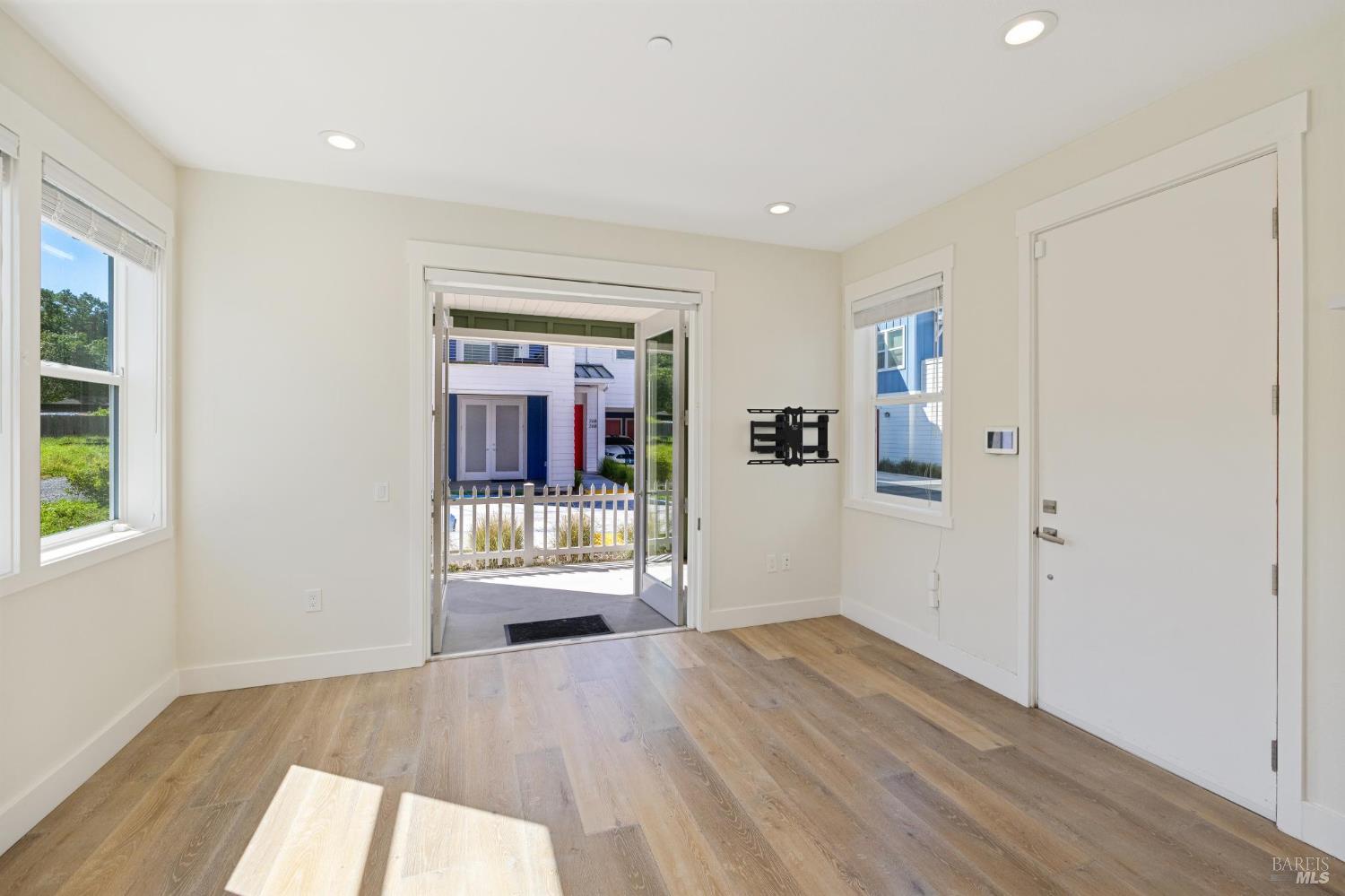 2672 Franz Kafka Avenue Santa Rosa, CA 95404 - Photo 5 of 25 wooden floor in an empty room with a window