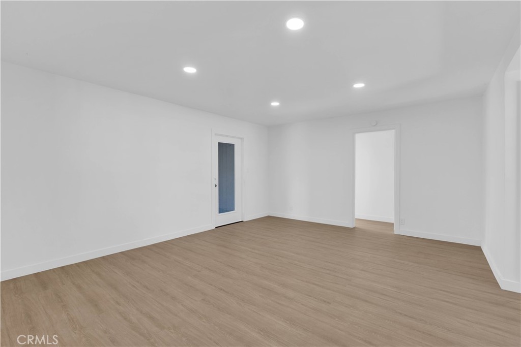 1007 North Mohawk Avenue Anaheim, CA 92801 - Photo 14 of 31 a view of an empty room with wooden floor