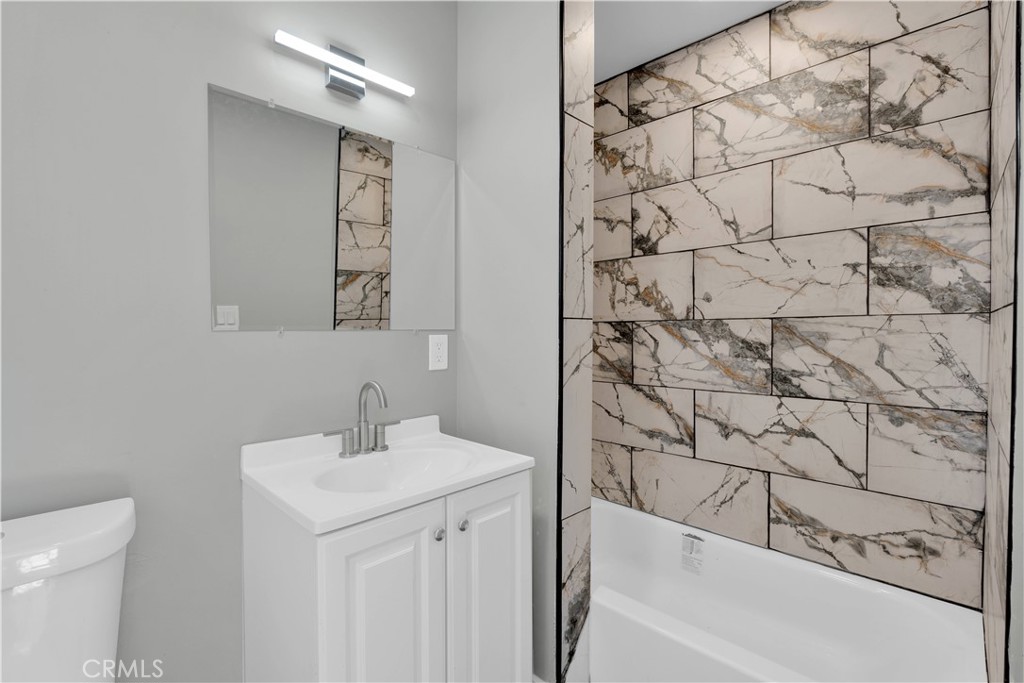 1007 North Mohawk Avenue Anaheim, CA 92801 - Photo 17 of 31 a bathroom with a sink and a bathtub