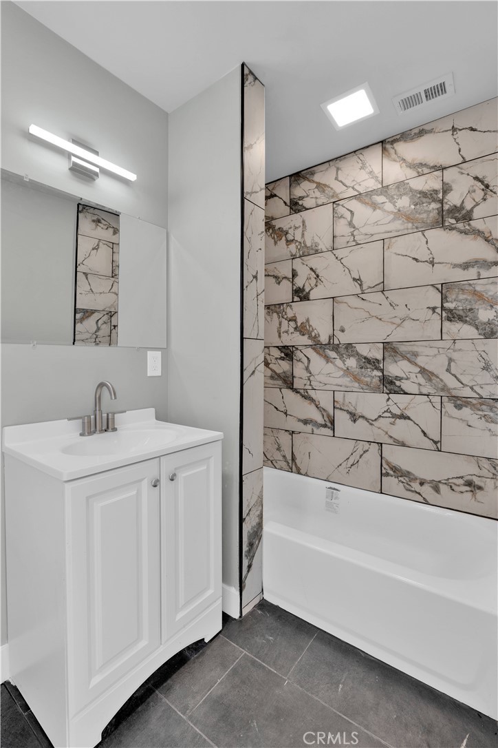 1007 North Mohawk Avenue Anaheim, CA 92801 - Photo 18 of 31 a bathroom with a sink and a bathtub