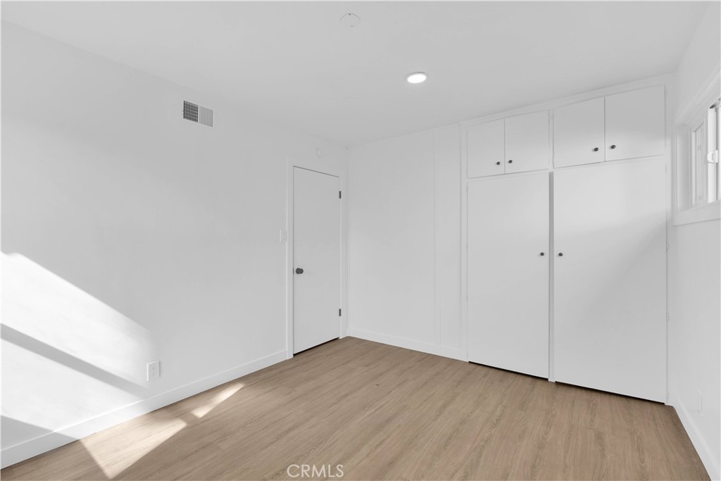 1007 North Mohawk Avenue Anaheim, CA 92801 - Photo 20 of 31 a view of an empty room with wooden floor