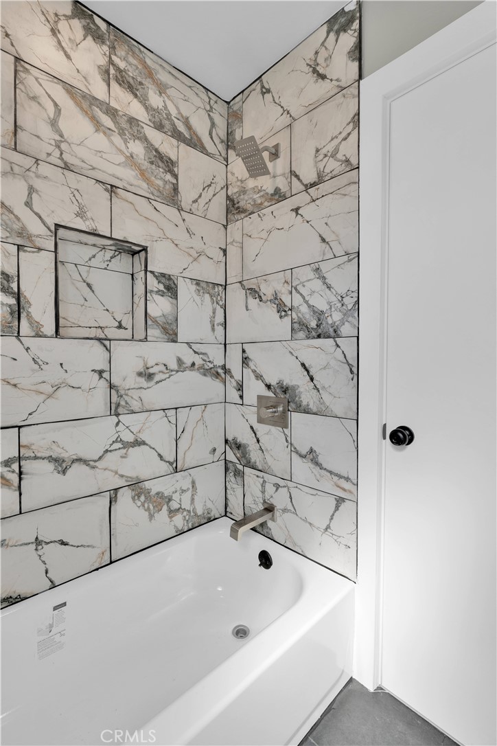 1007 North Mohawk Avenue Anaheim, CA 92801 - Photo 22 of 31 a bathroom with a bathtub and shower