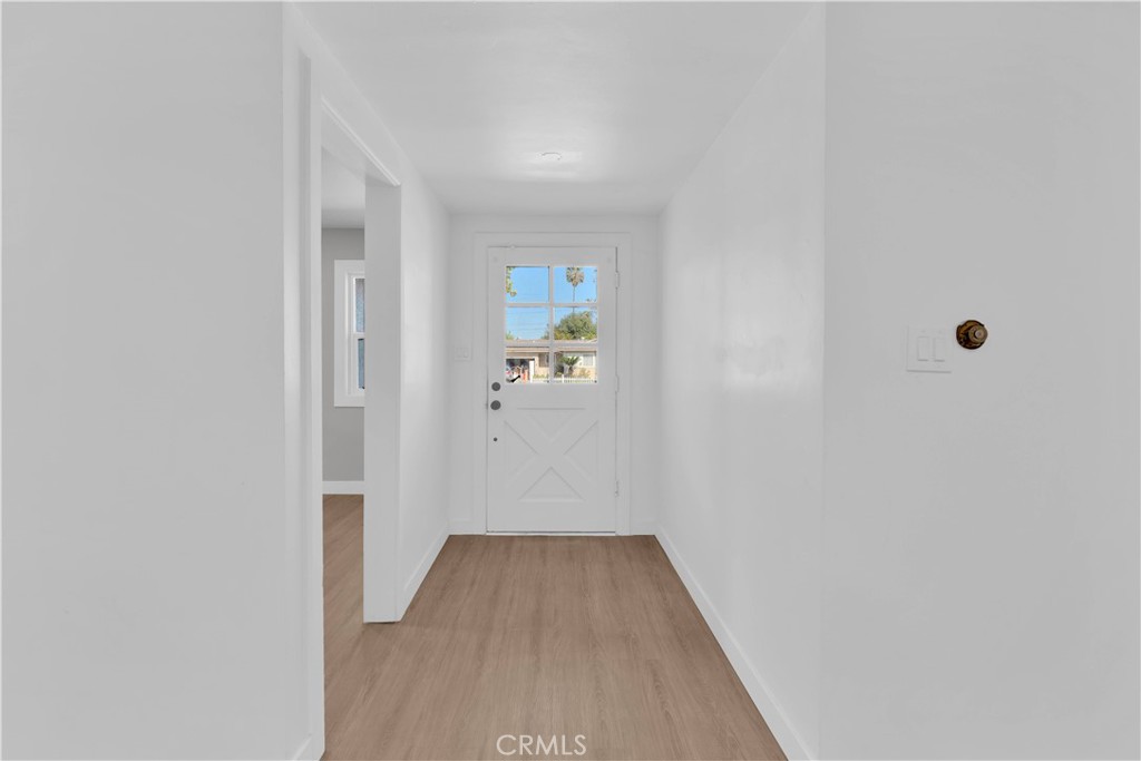 1007 North Mohawk Avenue Anaheim, CA 92801 - Photo 5 of 31 a view of a hallway with wooden floor