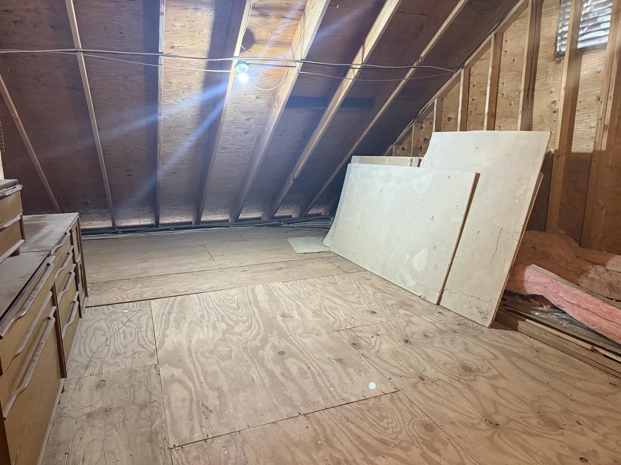 106 Redbud Drive Spicewood, TX 78669 - Photo 23 of 30 Large walk-in attic space accessible through passage door in back of Loft Closet