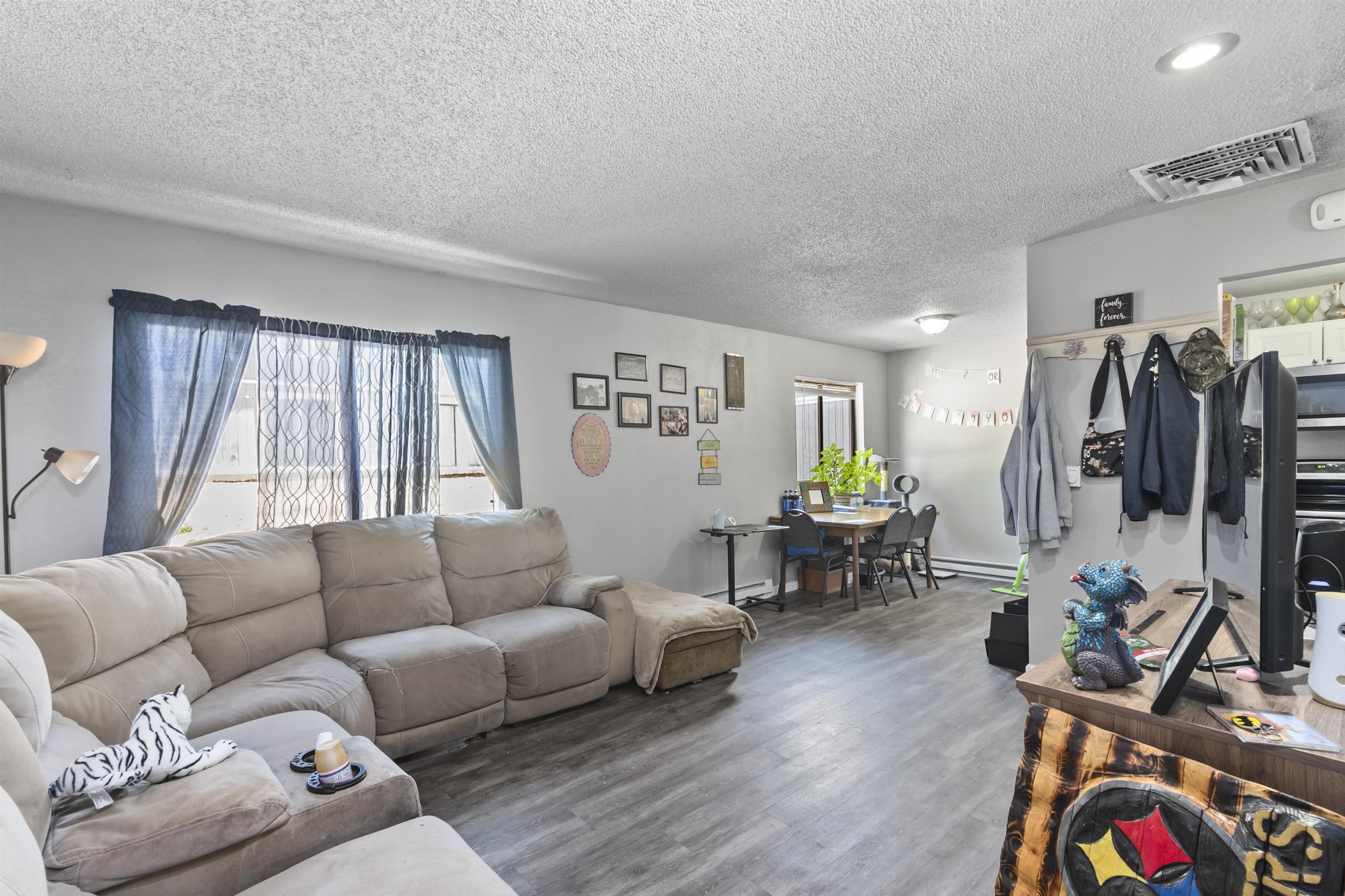 557 North Sparn Street Grand Junction, CO 81501 - Photo 12 of 31 a living room with furniture and wooden floor