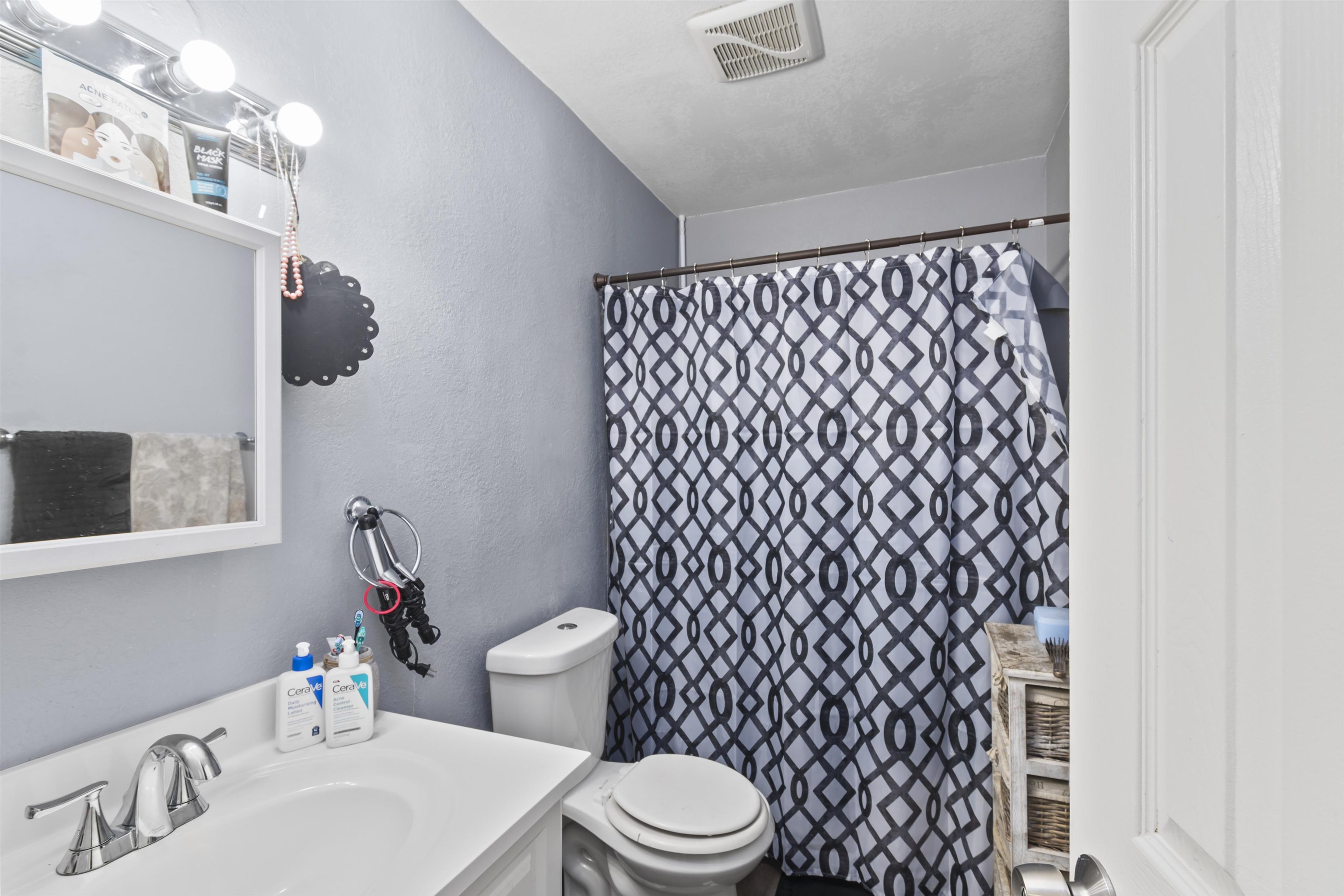 557 North Sparn Street Grand Junction, CO 81501 - Photo 16 of 31 a white toilet sitting next to a bathroom sink