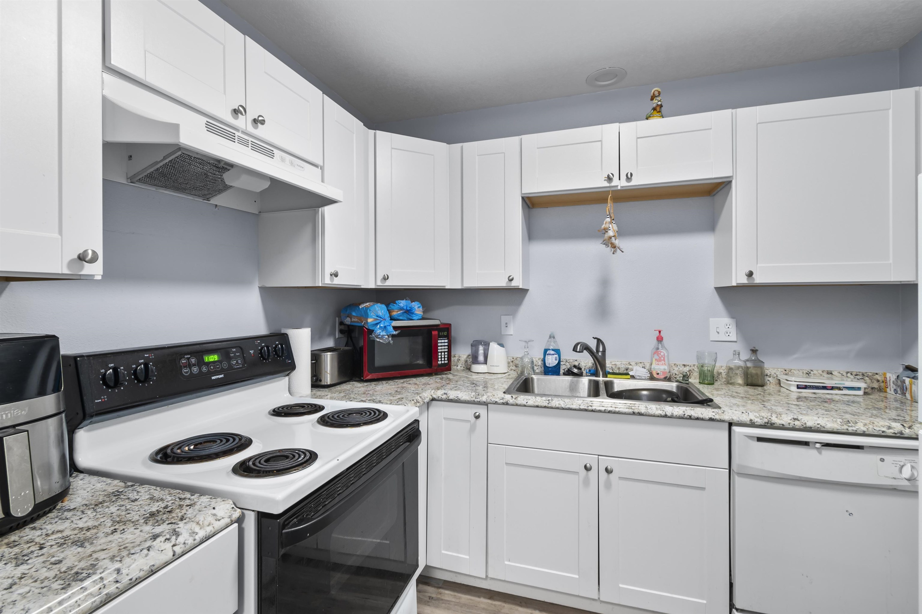 557 North Sparn Street Grand Junction, CO 81501 - Photo 23 of 31 a kitchen with a sink a stove and cabinets