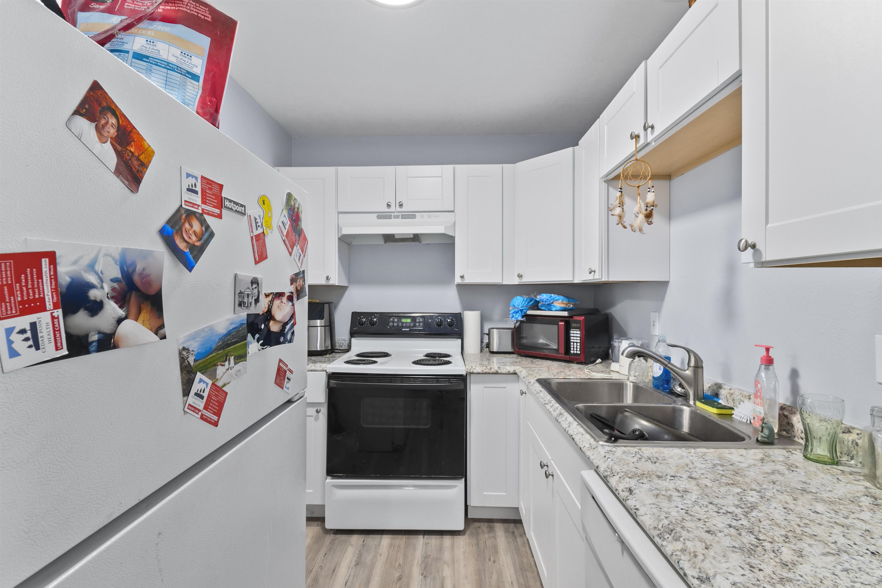 557 North Sparn Street Grand Junction, CO 81501 - Photo 24 of 31 a kitchen with a sink a stove and cabinets