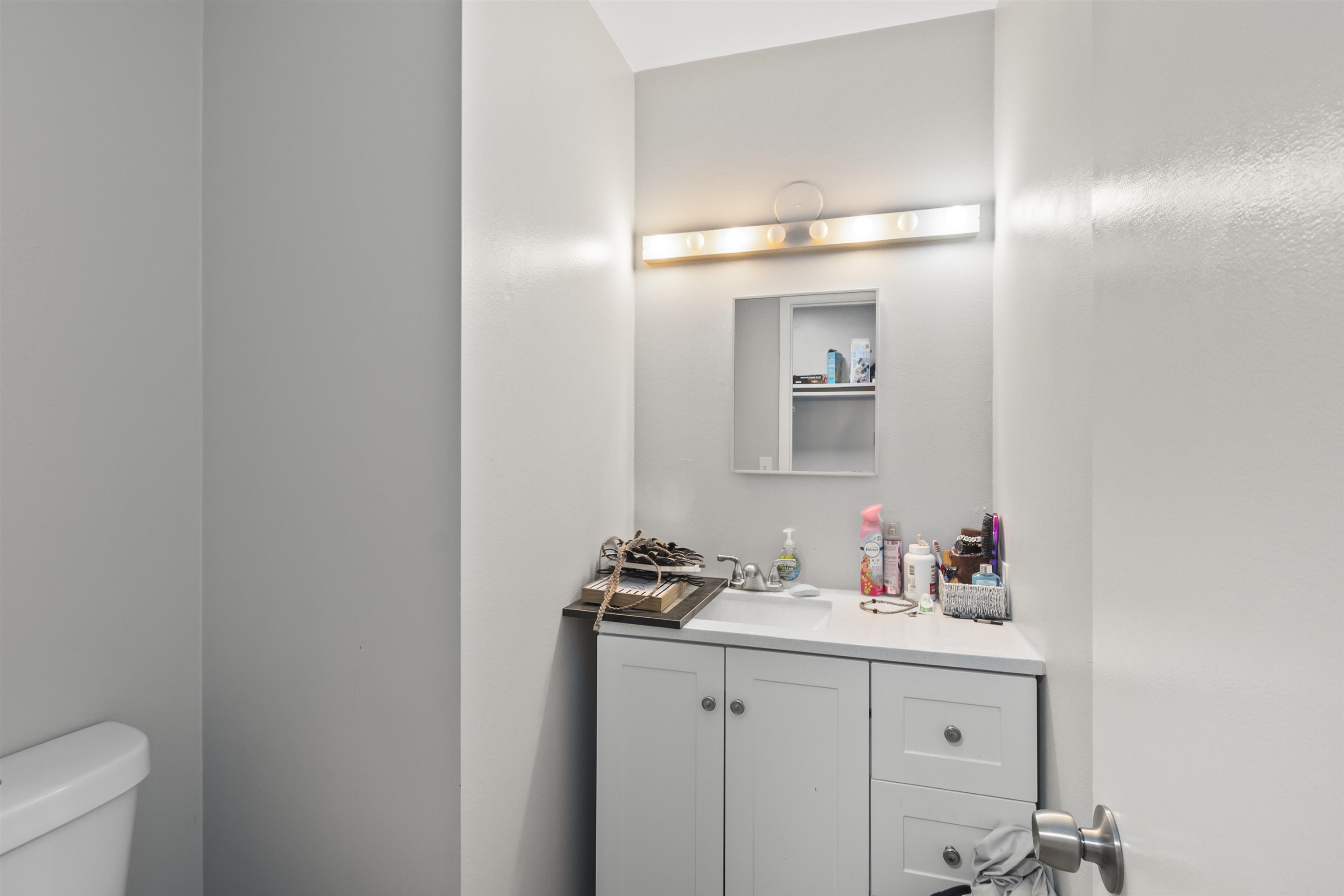557 North Sparn Street Grand Junction, CO 81501 - Photo 30 of 31 a bathroom with a sink and a mirror