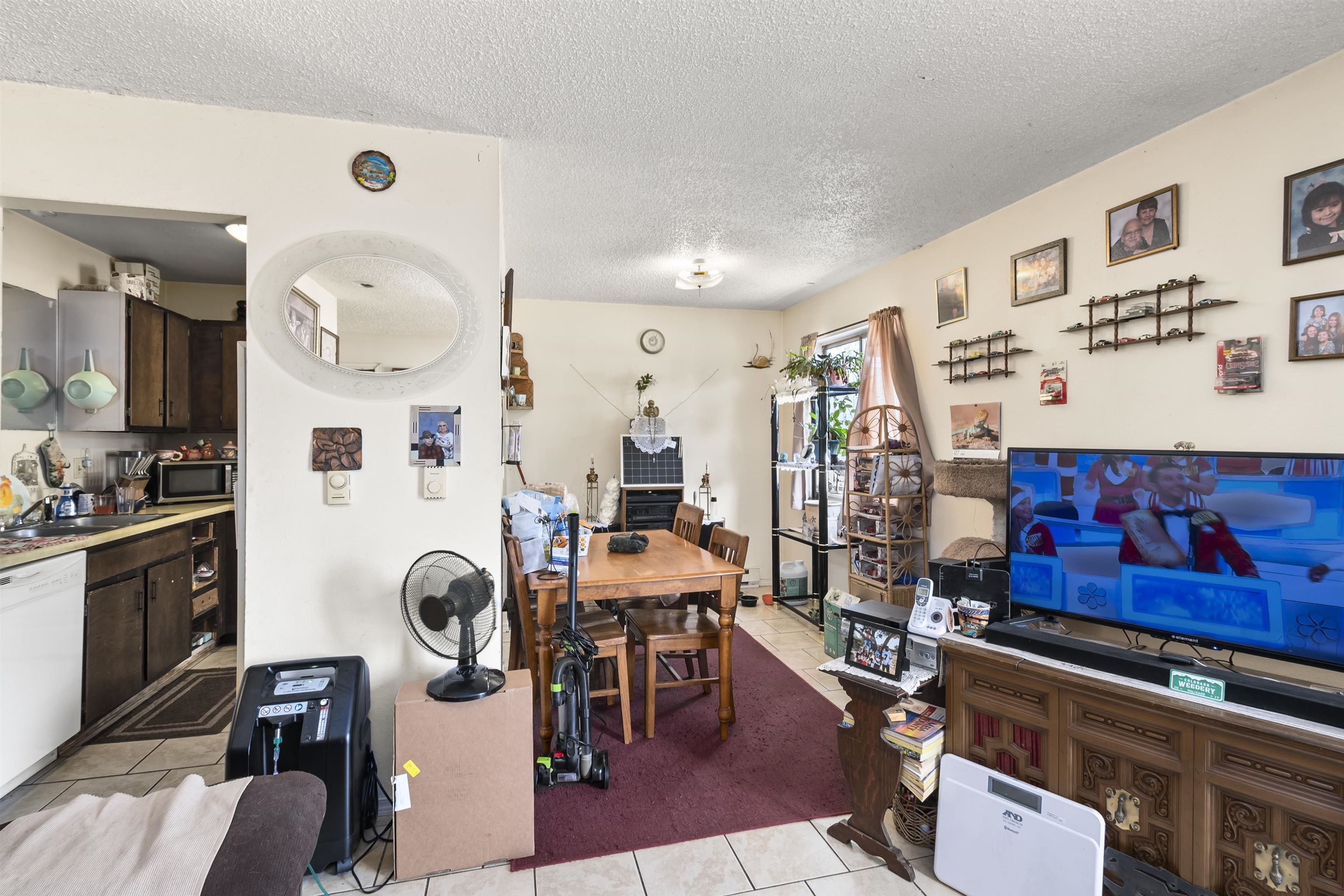 557 North Sparn Street Grand Junction, CO 81501 - Photo 5 of 31 a view of a room with gym equipment and refrigerator