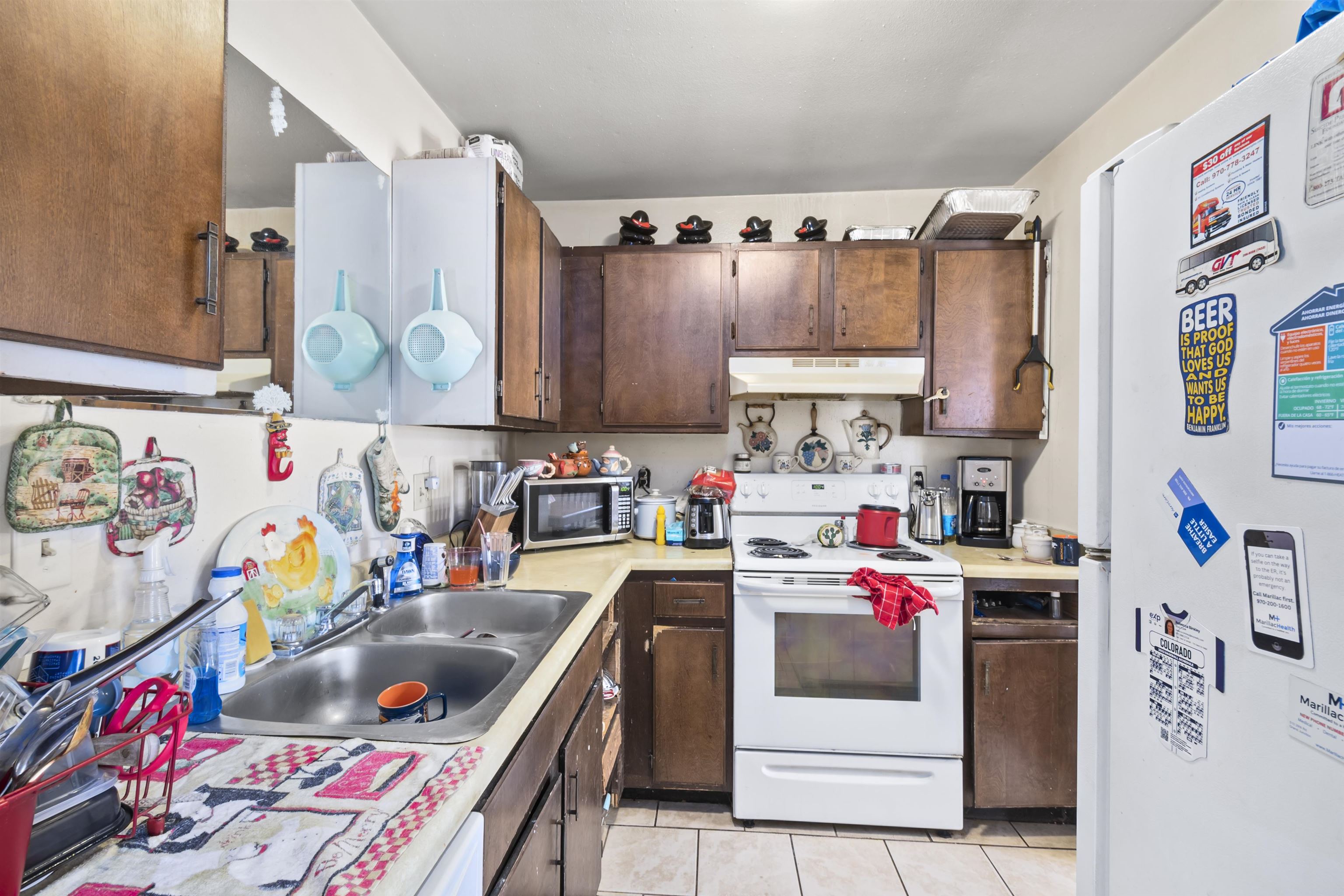 557 North Sparn Street Grand Junction, CO 81501 - Photo 6 of 31 a utility room with stainless steel appliances and cabinets