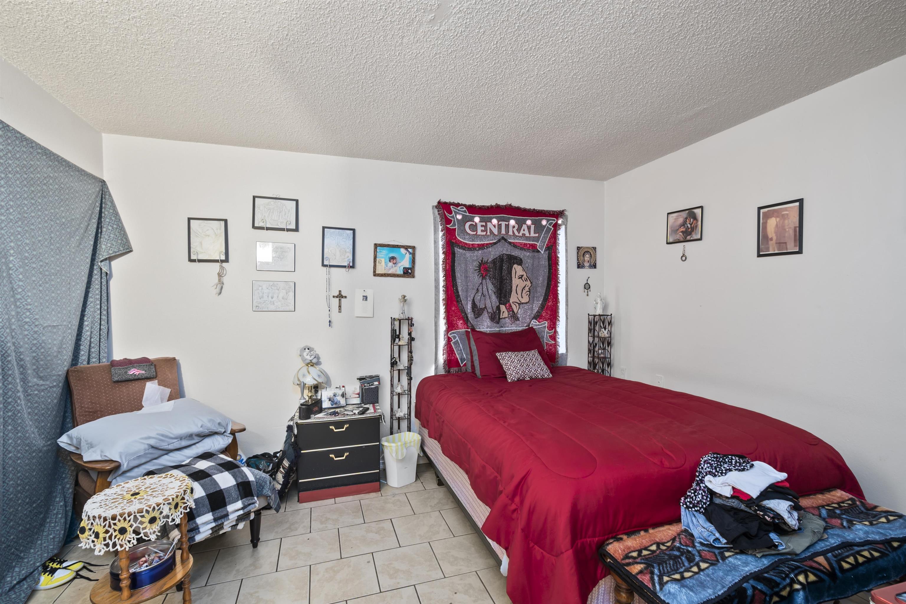 557 North Sparn Street Grand Junction, CO 81501 - Photo 9 of 31 a bedroom with bed and a couch