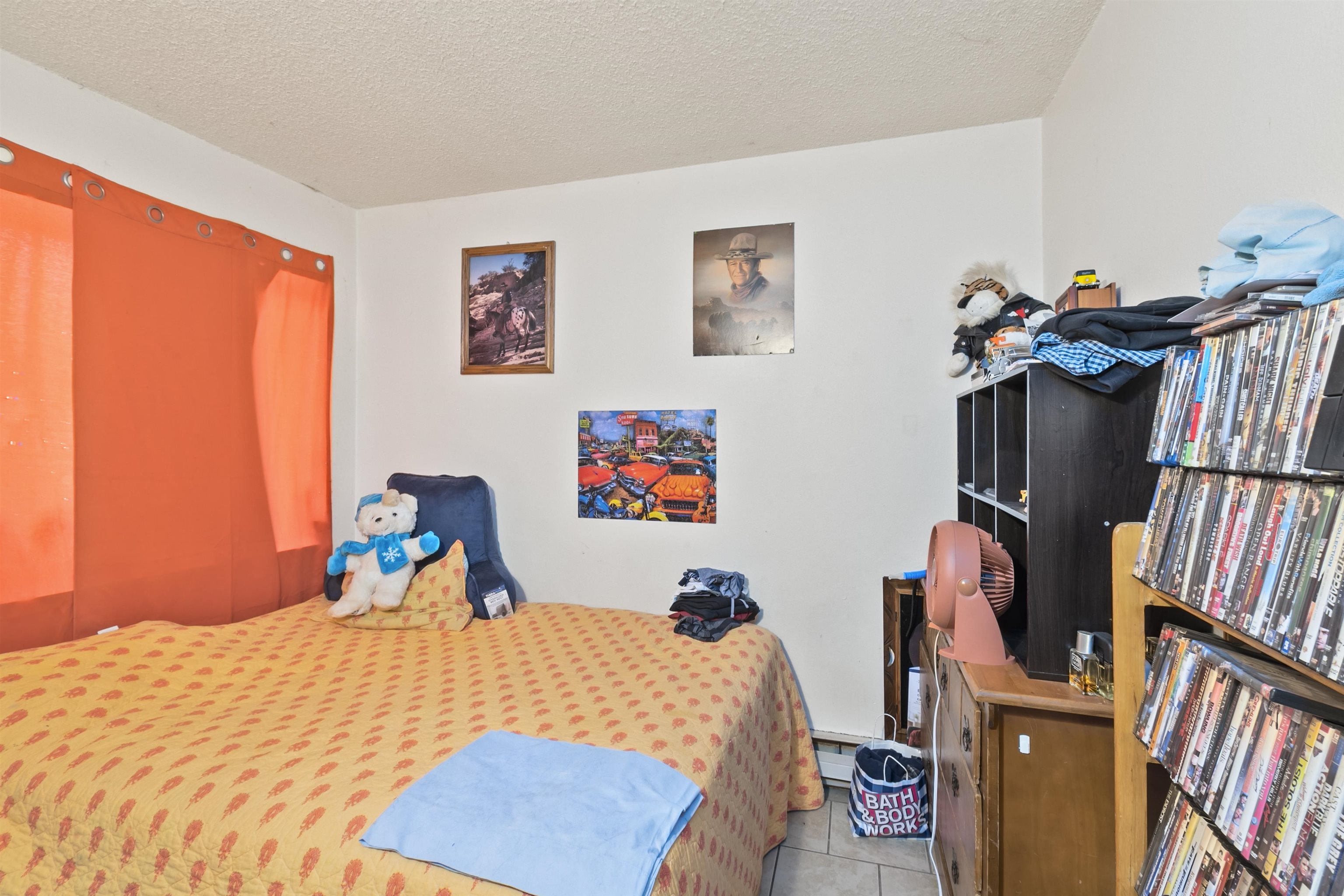 557 North Sparn Street Grand Junction, CO 81501 - Photo 10 of 31 a bed sitting in a bedroom next to a window