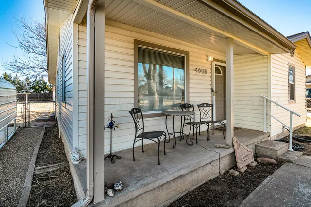 a view of a balcony with chairs