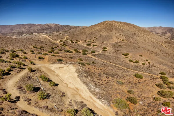 a view of a mountain view with mountains in the background
