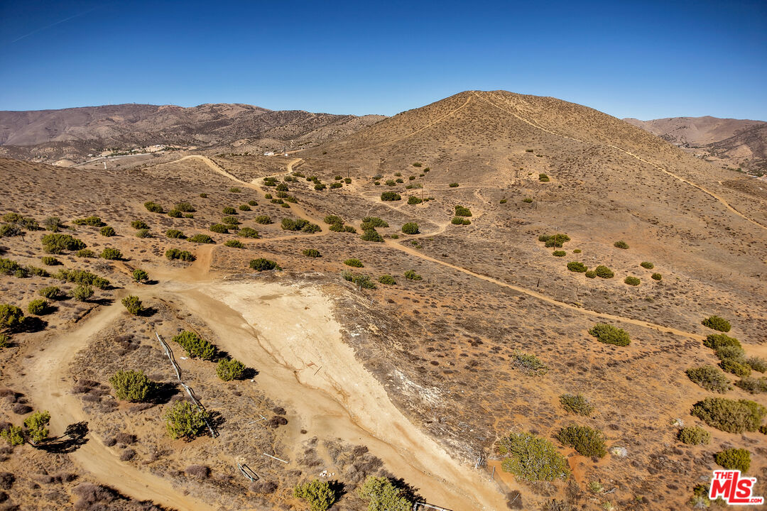 a view of a mountain view with mountains in the background
