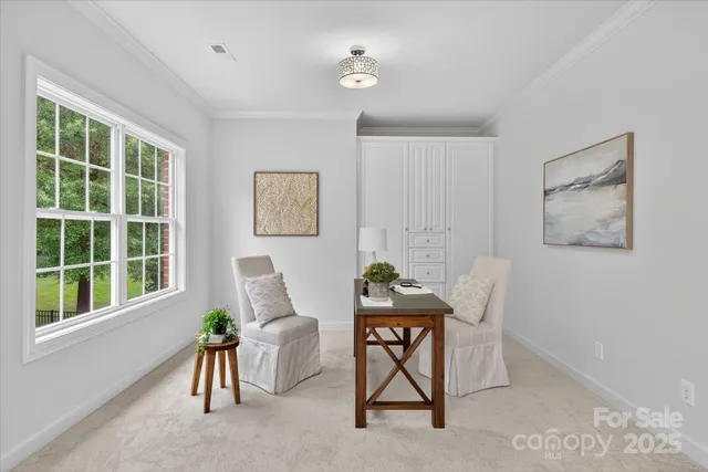 a workspace room with furniture and windows