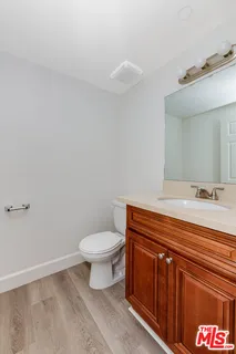 a view of a kitchen cabinets and wooden floor
