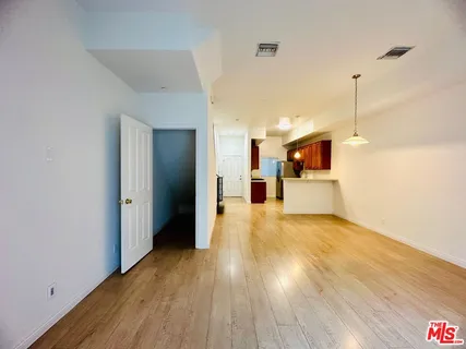 a view of a studio with wooden floor