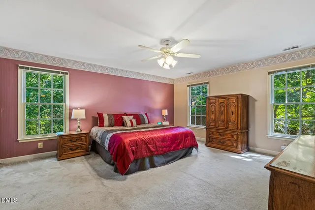 a bed room with a bed and a chandelier