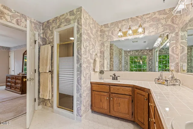 a spacious bathroom with a double vanity sink mirror and