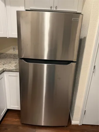 a kitchen with stainless steel appliances granite countertop a stove and a microwave