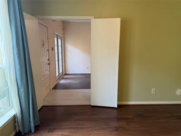 a white toilet sitting next to a bath tub