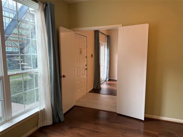 a bathroom with a toilet and a bathtub