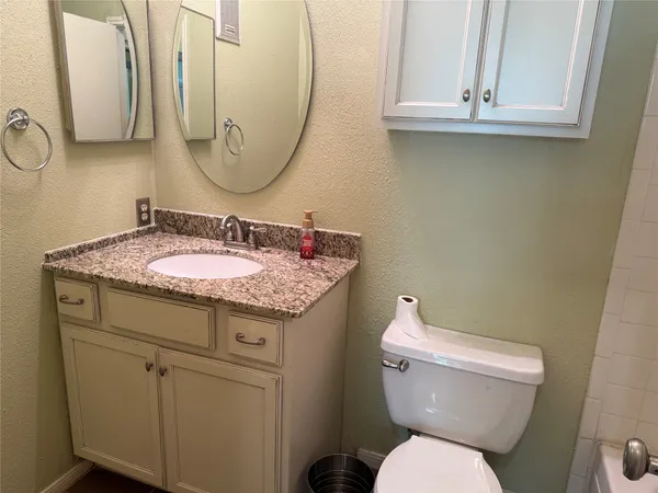 a view of room with window and wooden floor
