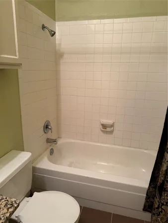 a view of hallway with wooden floor