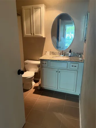 a view of a house with a yard patio and furniture