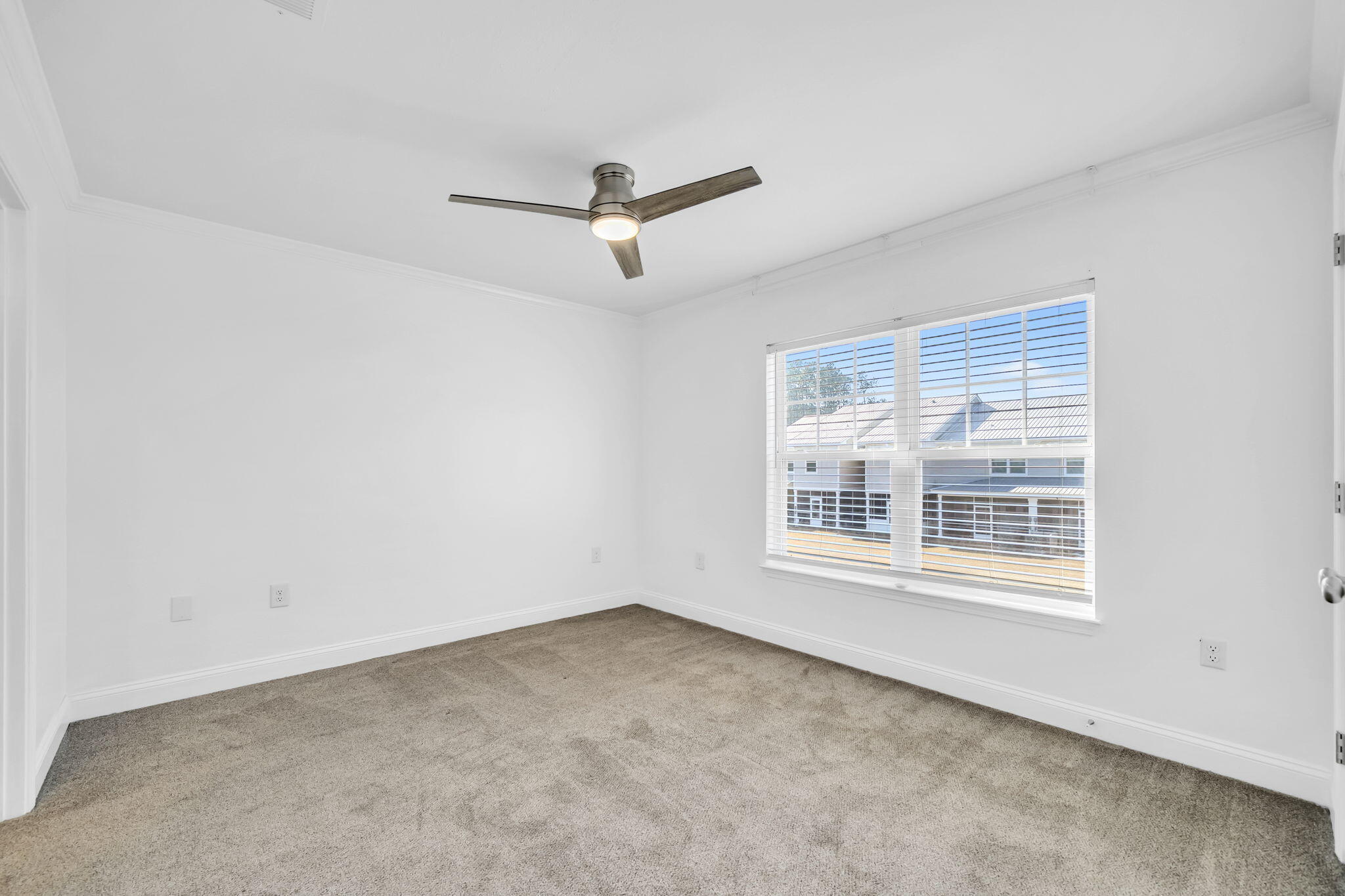 29 North Sand Palm Road Freeport, FL 32439 - Photo 14 of 40 a view of an empty room with a window