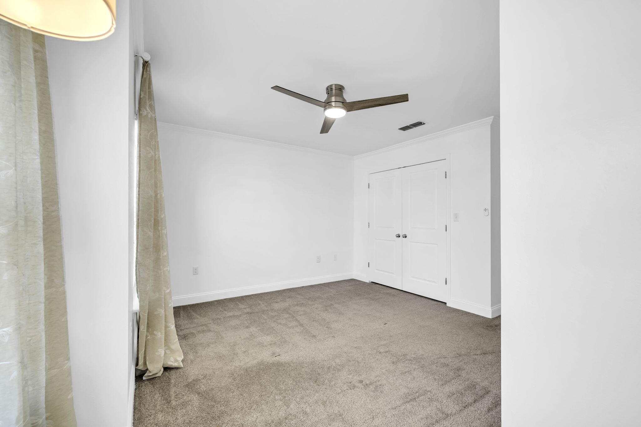 29 North Sand Palm Road Freeport, FL 32439 - Photo 17 of 40 a view of a room with a ceiling fan