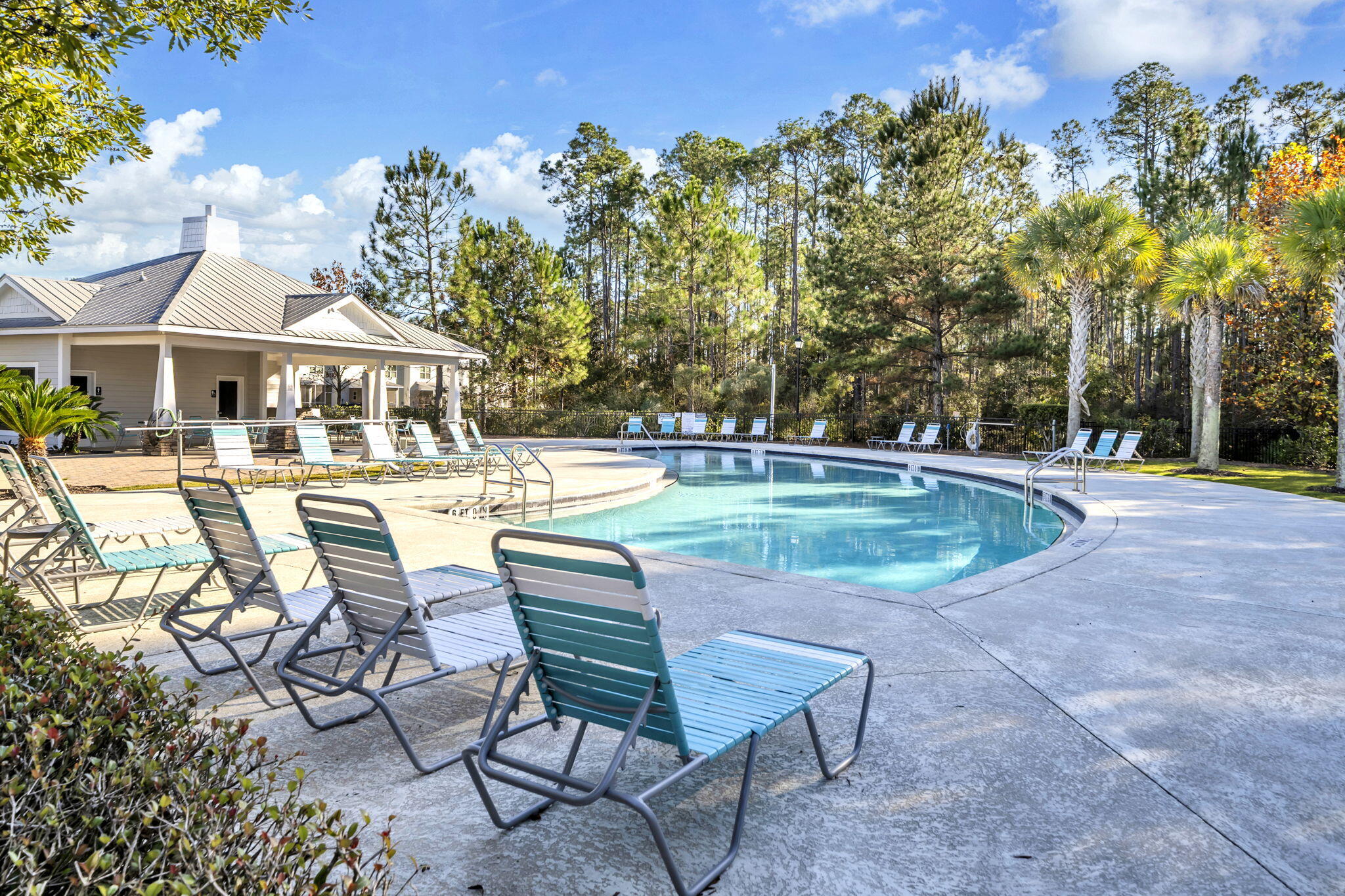 29 North Sand Palm Road Freeport, FL 32439 - Photo 21 of 40 a view of a house with swimming pool and sitting area