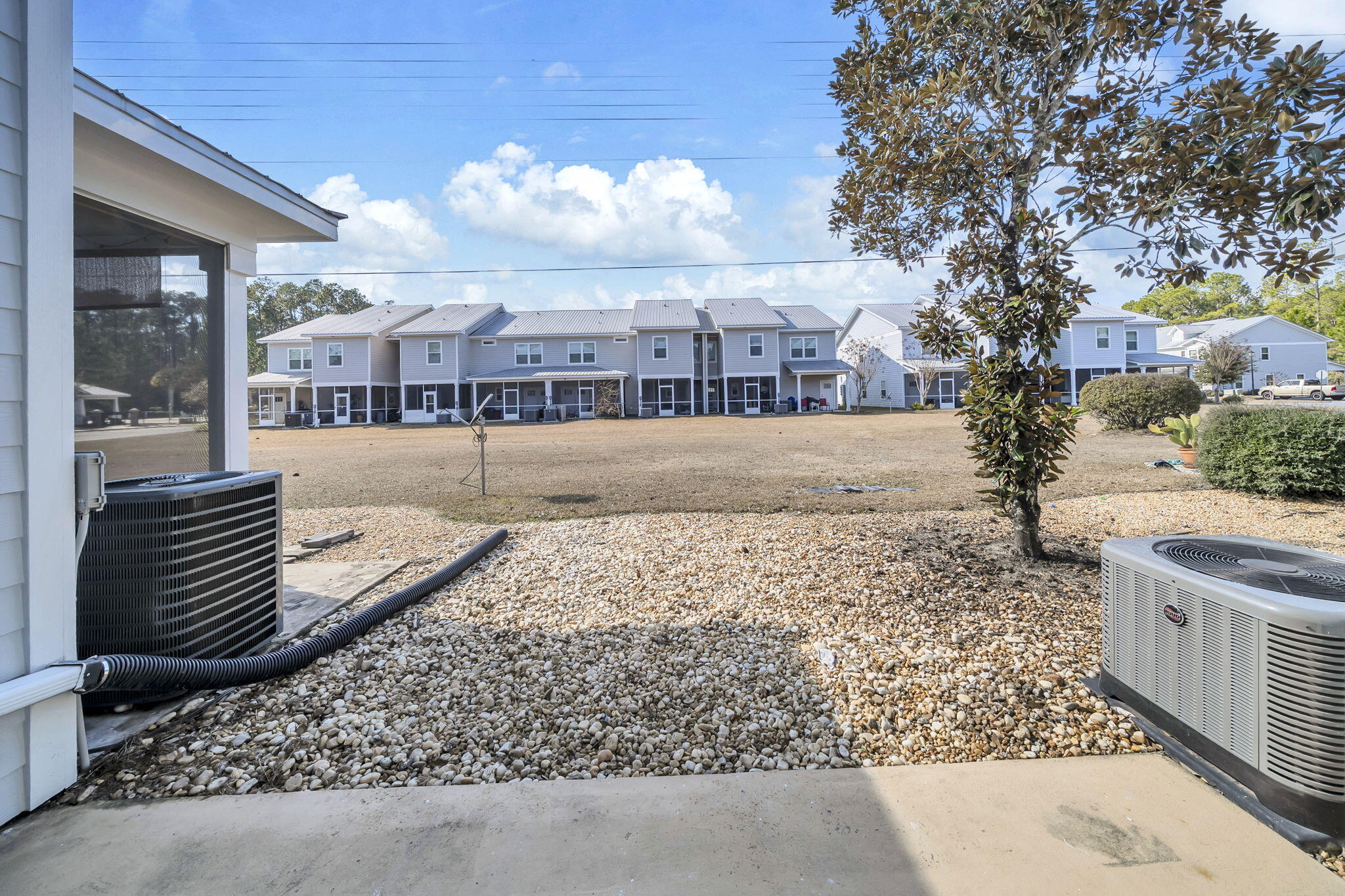 29 North Sand Palm Road Freeport, FL 32439 - Photo 26 of 40 a view of a yard and front view of a house